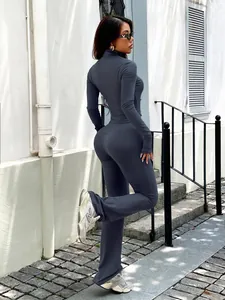 Full view of a grey Y2K yoga tracksuit set featuring long sleeve top and flared trousers