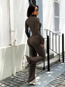 Full body side view of a brown two-piece Y2K yoga set with long sleeve top and flared pants