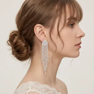 Elegant long silver tassel earrings with sparkling rhinestones for bridal wedding dinner look