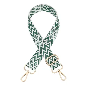Adjustable woven replacement bag strap with green geometric diamond pattern detail