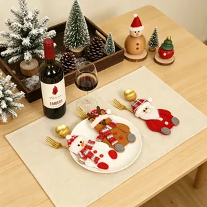 Set van drie kerstbestekhouders met motieven van de Kerstman, sneeuwpop en rendier