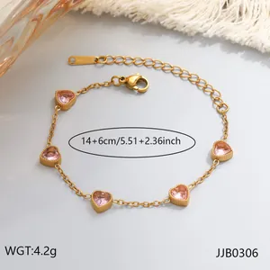 Detailed view of women's gold plated heart bracelet with pink gems and size info.