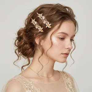 Elegant model wearing retro gold butterfly hairpins with sparkling rhinestones in a bun