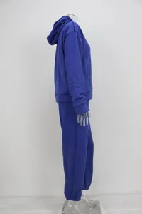 Side view of women's blue hooded tracksuit set for sporty and casual wear
