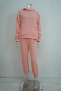 Women's two-piece pink casual tracksuit set with a hooded sweatshirt and matching joggers