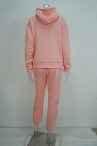 Detailed back view of a pink hooded sweatshirt and sweatpants tracksuit outfit set