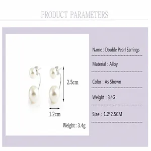 Detail view of double pearl jacket earrings showing size parameters and weight