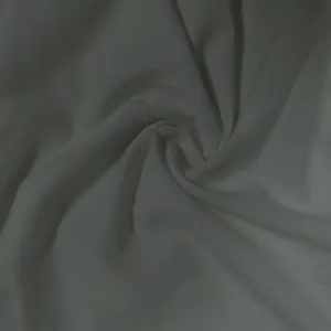 Close-up of soft white fabric texture showing elegant drape and smooth finish