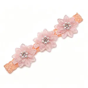 Soft elastic baby headband featuring three pink chiffon flowers with elegant pearl beads