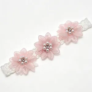 Elegant baby headband with three pink chiffon flowers, pearls and white lace