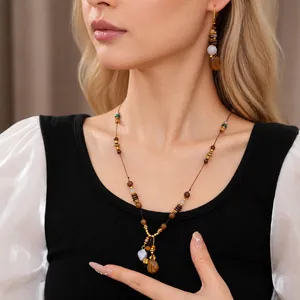 Elegant vintage ethnic wood beaded necklace and earrings jewelry set with resin pendant