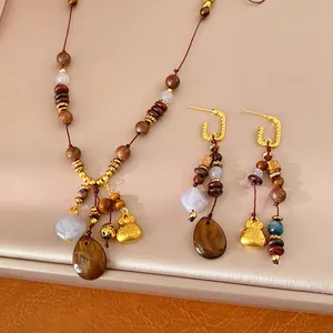 Vintage ethnic wood bead jewelry set with resin water drop and gold blessing bag charms