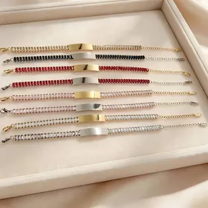 Detailed view of assorted stainless steel bracelets with vibrant cubic zirconia stones.