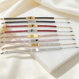Detailed view of stainless steel zirconia bracelets in multiple colors on silk background