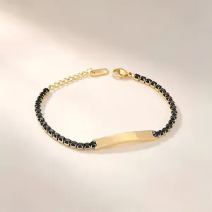 Gold-plated stainless steel bracelet with black zircons and an engravable ID plate