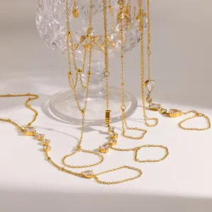 Conjunto de collares en Y de acero dorado con circonitas cúbicas en forma de gota