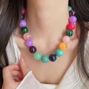 Fashionable dopamine colorful acrylic beaded necklace for women shown on a model.