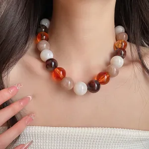 Vibrant colorful acrylic beaded dopamine necklace shown on model for stylish jewelry detail