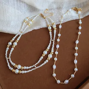 Gedetailleerd overzicht van elegante Franse vintage parelketting met gouden kralen