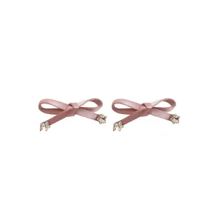 Elegante roze strik haarspeldjes met sprankelende ster strass accenten voor dames