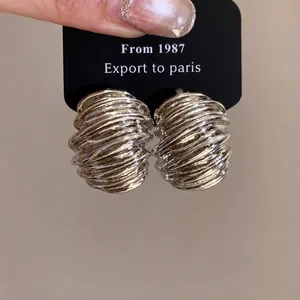 Vintage silver geometric textured stud earrings featuring a chunky swirled design for women