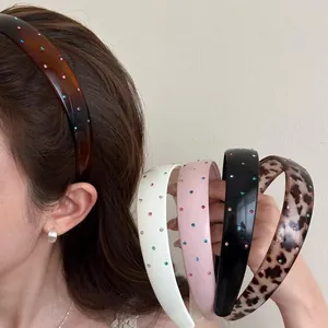 Detailed close-up view showing various colors of Korean style rhinestone wide headbands