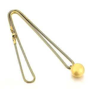 Elegant minimalist golden snake chain necklace featuring a large polished ball pendant