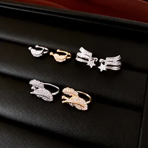 Elegant zircon star and feather ear cuffs in gold and silver for non-pierced ears.