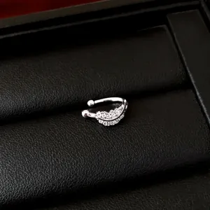 Minimalist silver zircon ear cuff with sparkling crescent design for non-pierced ears