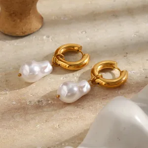 Detailed view of elegant 18K gold plated hoop earrings with baroque pearl drops