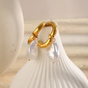 Detailed view of 18K gold plated hoop earrings with elegant irregular baroque pearls