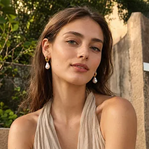 Elegant French style 18K gold-plated stainless steel earrings with baroque pearl drops.