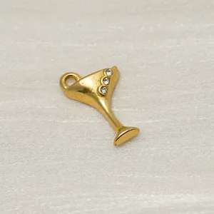 Close-up of 14K gold plated cocktail glass charm with three small sparkling crystals