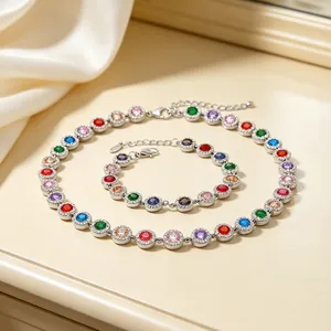 Detail shot of multi-colored zircon halo necklace and bracelet set in silver finish