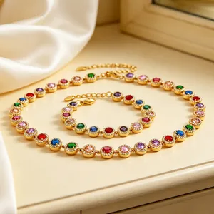 Detailed view of gold-tone colorful zircon halo necklace and bracelet jewelry set
