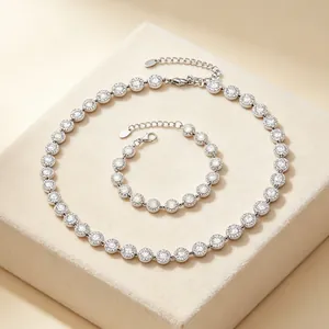 Silver-tone necklace and bracelet set with round halo zircon pavé crystals on velvet stand