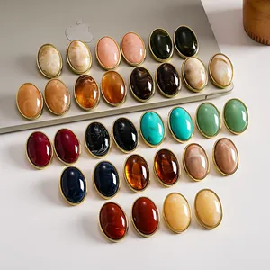 Variety of vintage acrylic marbled oval stud earrings in multiple colors and patterns.