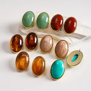 Detailed close-up showing vintage oval acrylic marble stud earrings in various marble patterns