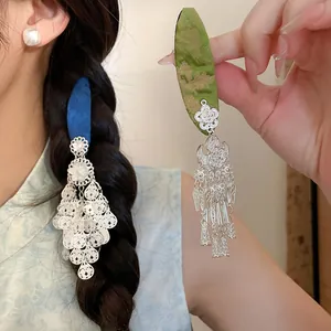 Detail view of silver floral tassel hair clips for Hanfu, showing delicate craftsmanship