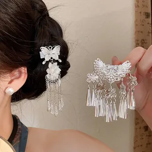 Detail of vintage silver butterfly and flower tassel hair clips for Hanfu hairstyles