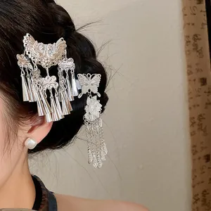 Detailed view of silver butterfly and floral tassel hair clips for Hanfu styling