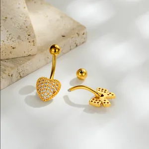 Piercings de ombligo de lujo en acero inoxidable dorado con corazón y lazo circón
