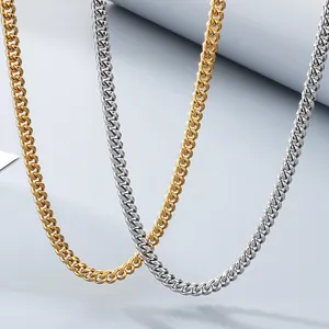 Close-up of gold and silver stainless steel Cuban link necklaces for men and women