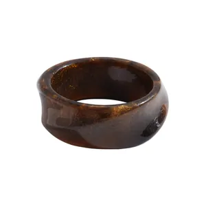 Vintage resin marbled geometric bangle bracelet with golden glitter and brown swirls pattern