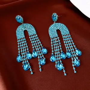 Exaggerated blue rhinestone water drop tassel earrings with silver pins for stylish women