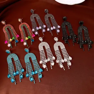Detailed showcase of luxury rhinestone tassel earrings with teardrop charms in multiple colors