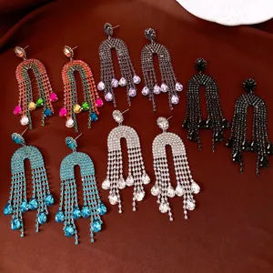 Close-up of luxury rhinestone teardrop tassel earrings in multiple vibrant colors