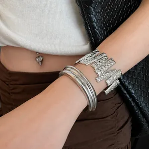 Stylish silver-tone metal open cuff bracelets with textured and smooth finishes