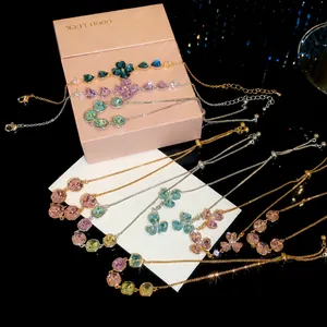 Elegant 18k gold plated bracelets with sparkly zircons and pearls displayed on gift box.