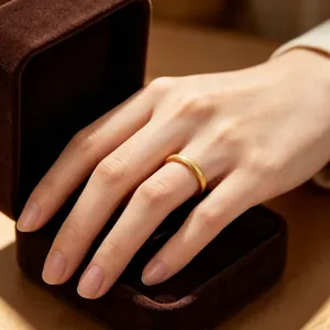 Close-up of a gold frosted titanium steel ring with a starry matte texture.